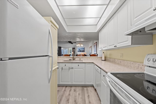 kitchen featuring white cabinets, white appliances, sink, and light hardwood / wood-style floors