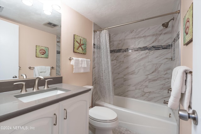 full bathroom featuring toilet, vanity, shower / bath combination with curtain, and a textured ceiling