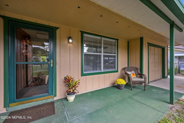 property entrance with covered porch