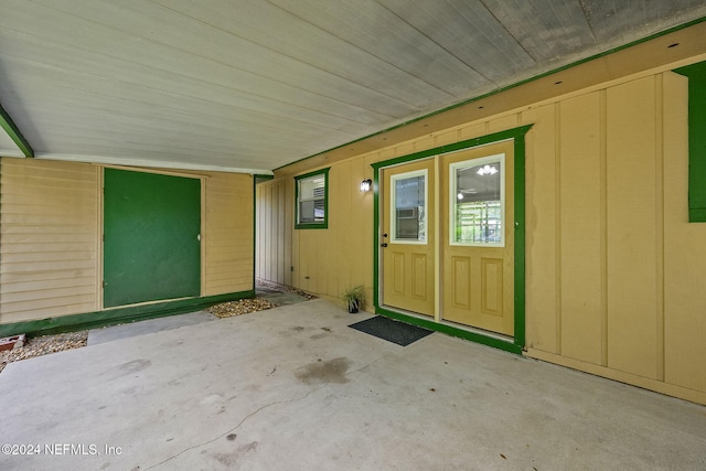 doorway to property with a patio area