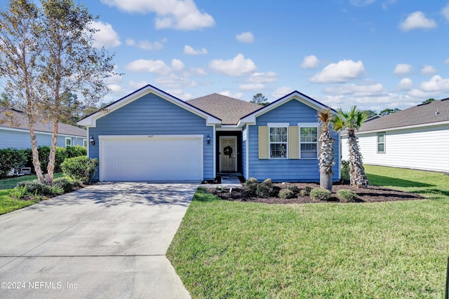 ranch-style home featuring a front lawn and a garage