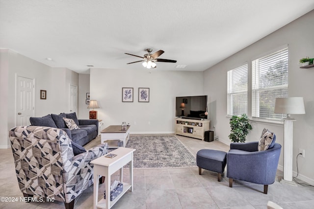 647 La Mancha Dr, Saint Augustine, FL 32086 - living room with a ceiling fan, light tile patterned flooring, and baseboards