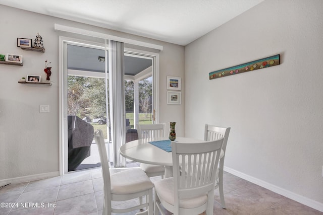 647 La Mancha Dr, Saint Augustine, FL 32086 - dining room featuring light tile patterned floors and baseboards
