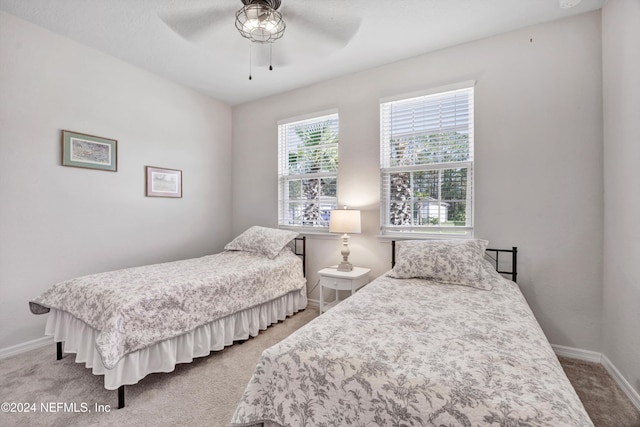 647 La Mancha Dr, Saint Augustine, FL 32086 - bedroom with light colored carpet, baseboards, and ceiling fan