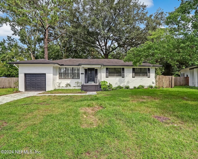 single story home featuring a front yard and a garage