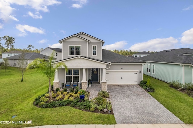 view of front of home featuring covered porch, a front lawn, and a garage