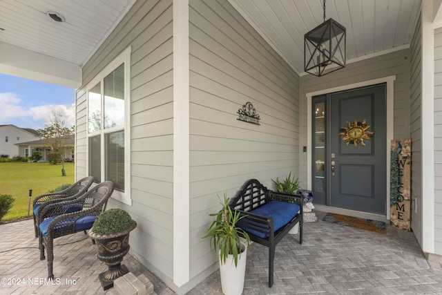 entrance to property featuring covered porch