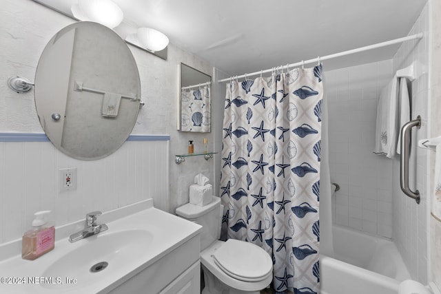 full bathroom with vanity, toilet, and shower / tub combo