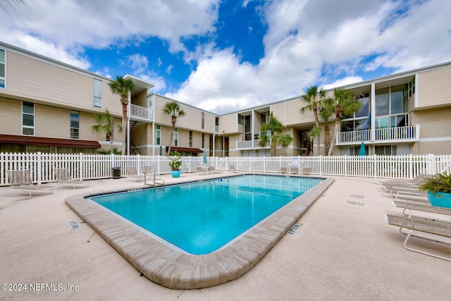 view of pool featuring a patio