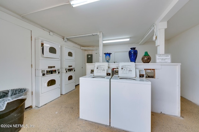 clothes washing area featuring stacked washer / dryer and washer and dryer