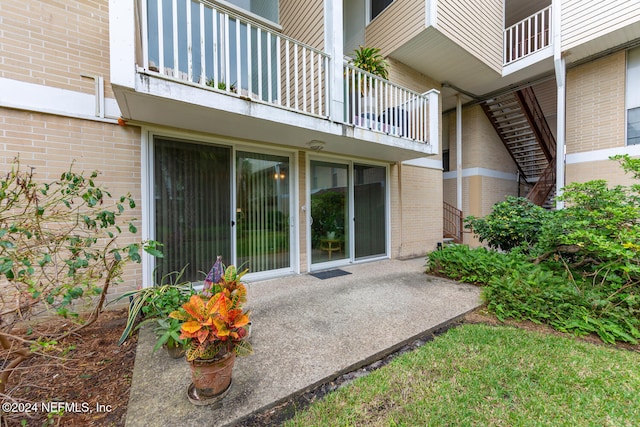 exterior space featuring a patio area and a balcony