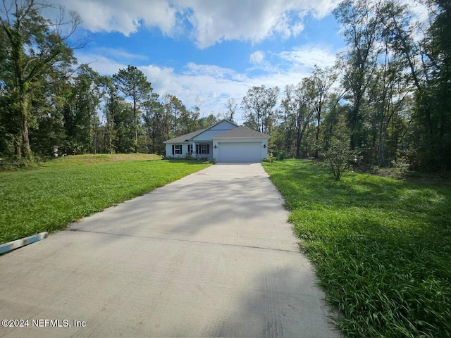 ranch-style house with a garage and a front yard