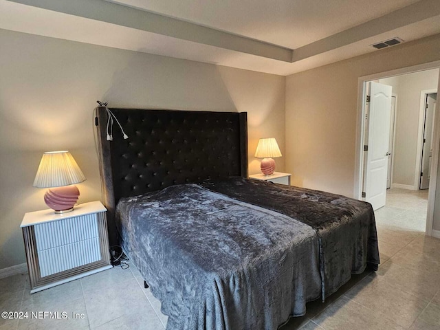 bedroom featuring light tile patterned floors