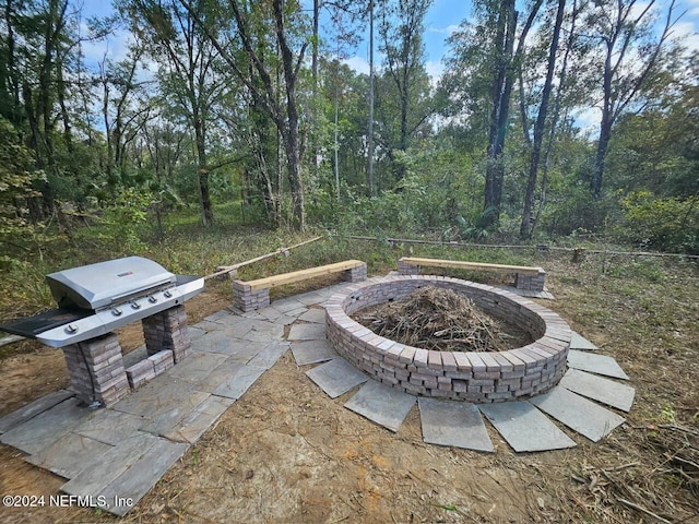 view of patio / terrace featuring a fire pit