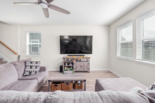 living room with hardwood / wood-style floors and ceiling fan