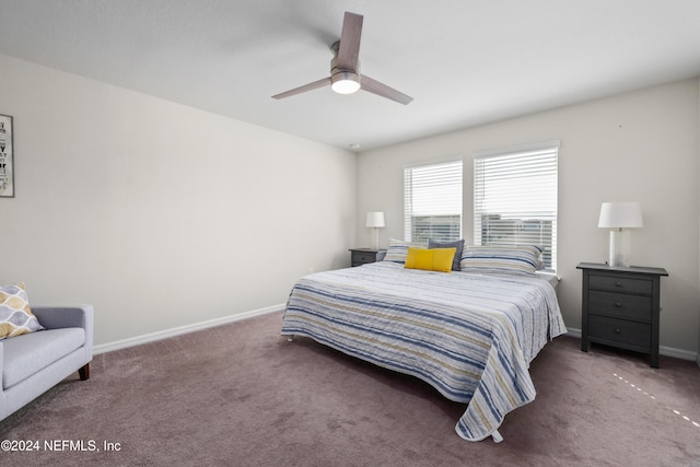 bedroom with ceiling fan and dark carpet