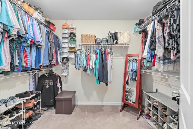 spacious closet with carpet flooring