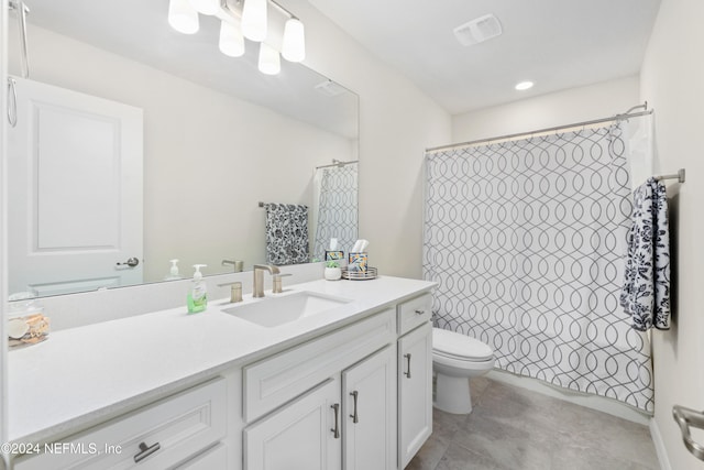 bathroom with toilet, a shower with curtain, vanity, and tile patterned floors