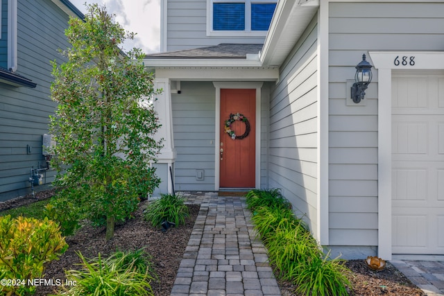 property entrance featuring a garage