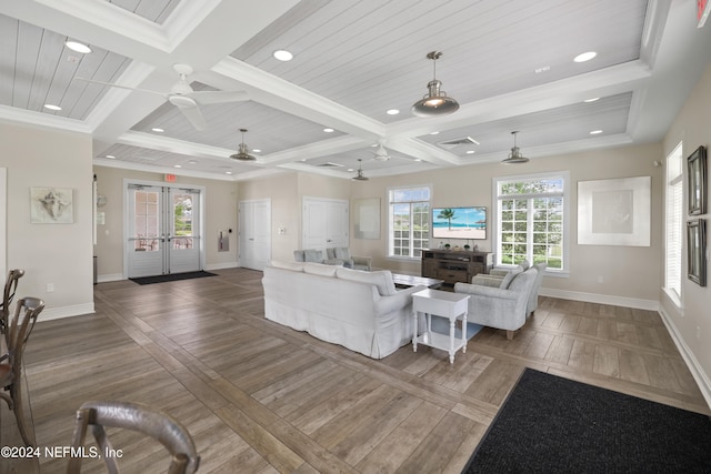 living room with dark wood-type flooring, a wealth of natural light, french doors, and ceiling fan