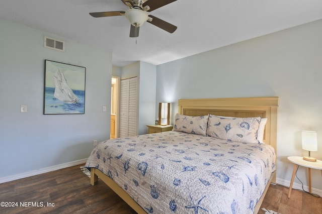 bedroom featuring a closet, ceiling fan, and dark hardwood / wood-style flooring