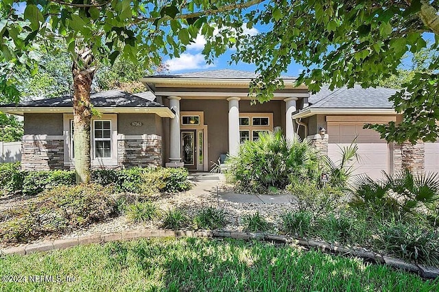 prairie-style home featuring a garage