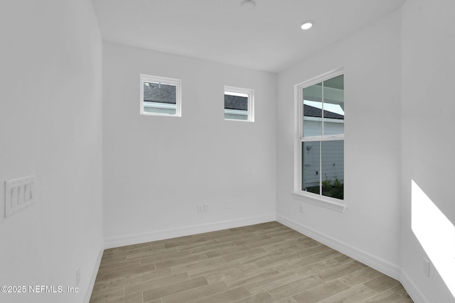 unfurnished room featuring light hardwood / wood-style flooring