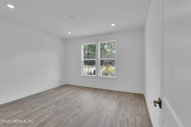 empty room with light hardwood / wood-style floors