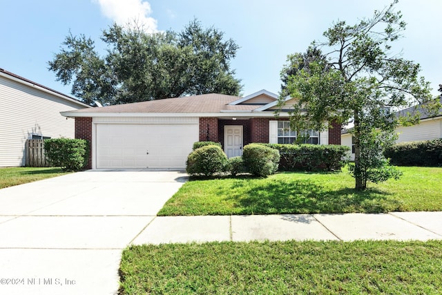 ranch-style house featuring a front yard and a garage