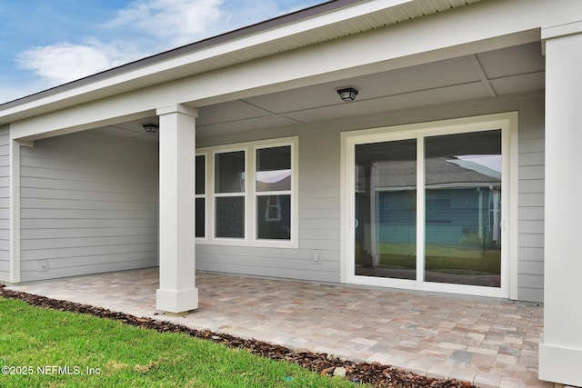 property entrance featuring a patio