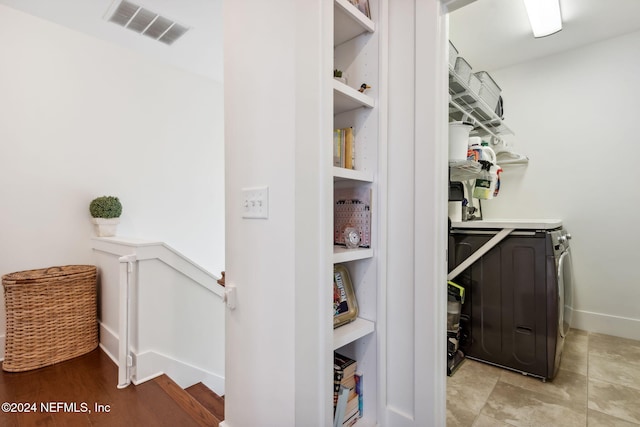 pantry featuring washer and dryer