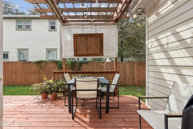 wooden deck featuring a pergola