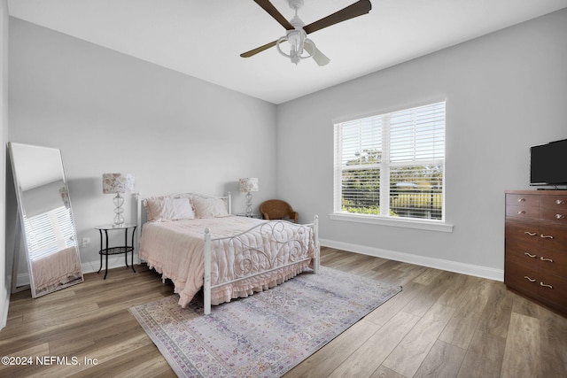 bedroom featuring ceiling fan and light hardwood / wood-style floors