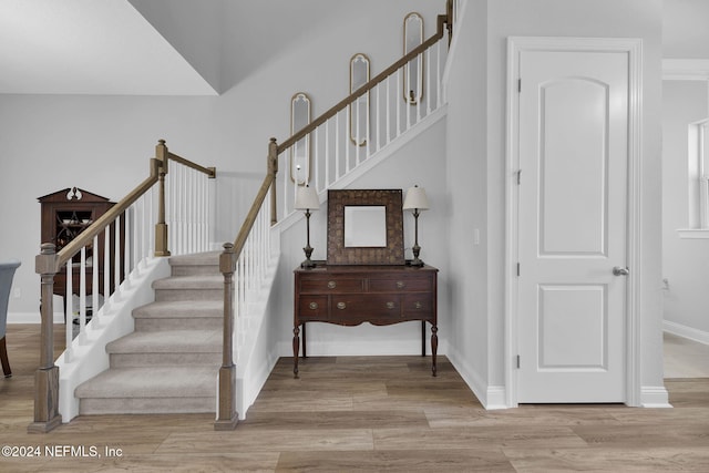 stairs with wood-type flooring