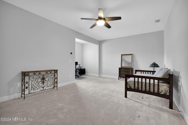 carpeted bedroom with ceiling fan