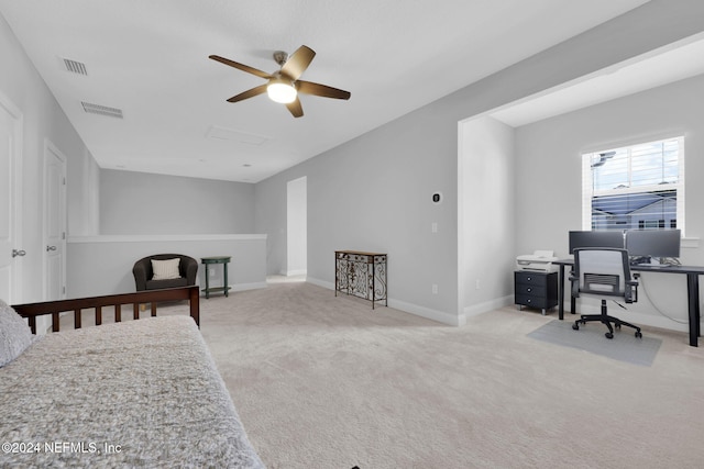 bedroom featuring light carpet and ceiling fan