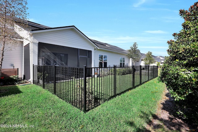 view of yard featuring a sunroom