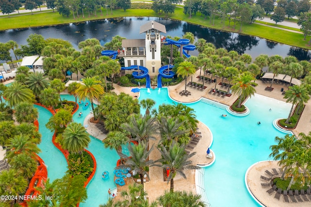 birds eye view of property with a water view