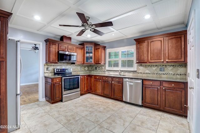 kitchen with appliances with stainless steel finishes, sink, backsplash, coffered ceiling, and ornamental molding