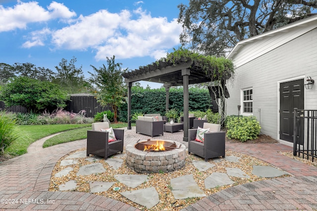 view of patio featuring an outdoor living space with a fire pit