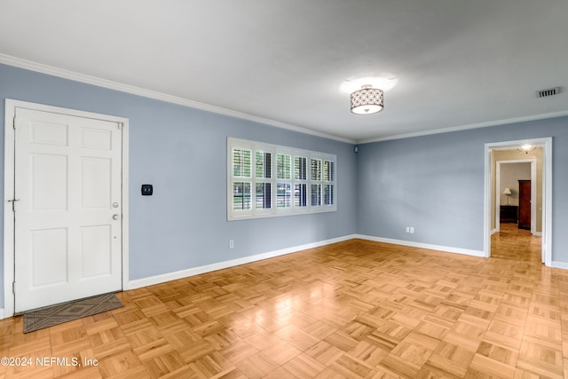 spare room featuring light parquet floors and crown molding