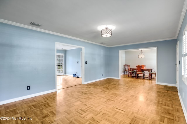 spare room featuring crown molding and light parquet floors