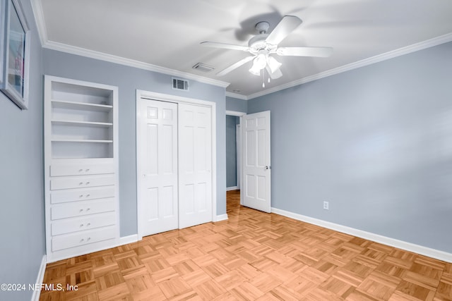 unfurnished bedroom featuring ceiling fan, light parquet flooring, and ornamental molding