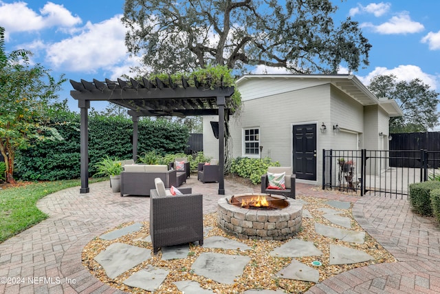 view of patio / terrace with an outdoor living space with a fire pit