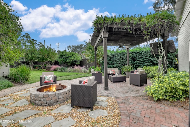 view of patio featuring a pergola and an outdoor living space with a fire pit