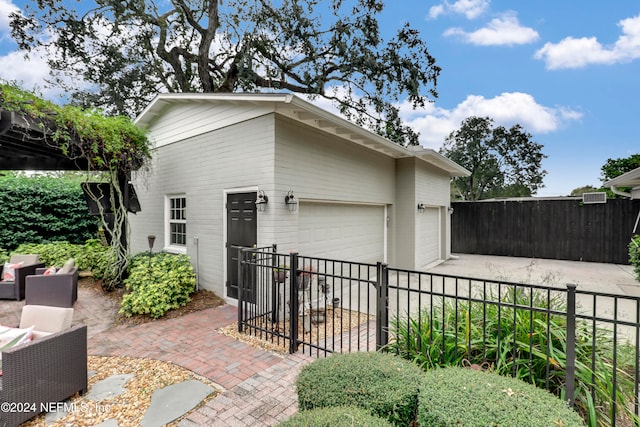 view of side of home featuring a garage