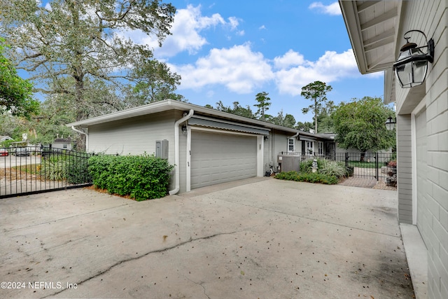 view of property exterior with a garage