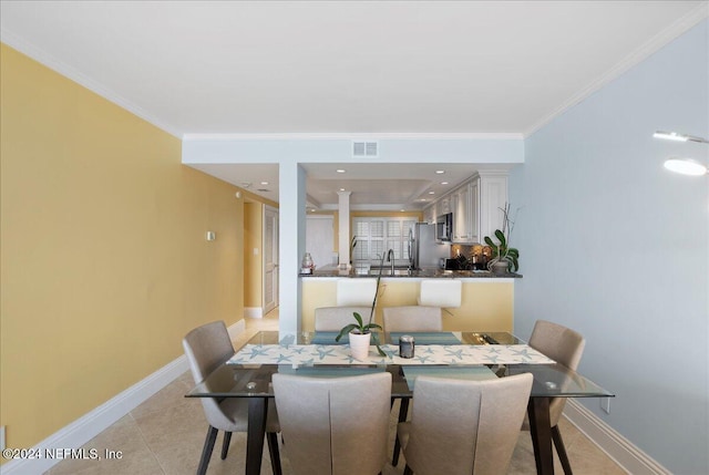 tiled dining space with crown molding