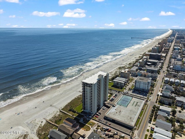 bird's eye view featuring a view of the beach and a water view