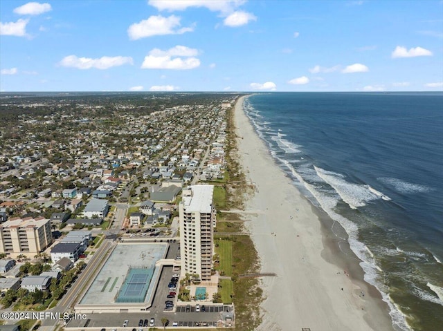 drone / aerial view with a water view and a view of the beach